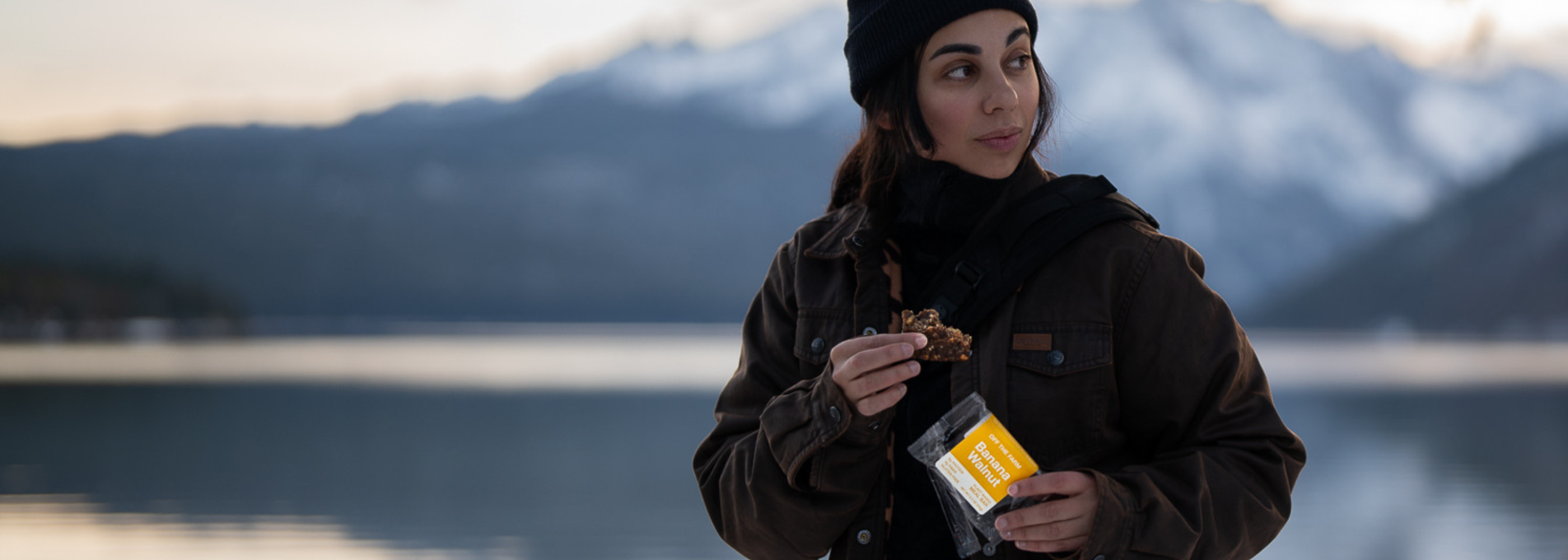 Woman eating banana walnut bar