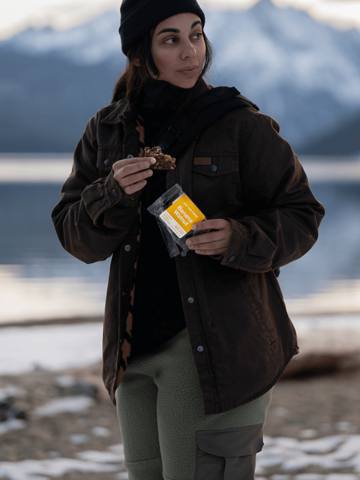 Woman eating banana walnut bar